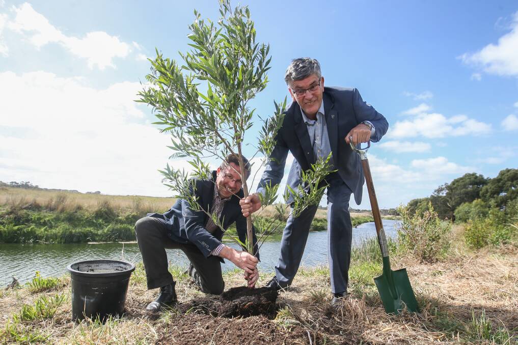 HEALTHY RIVER: MP Anthony Carbines and Glenelg Hopkins CMA chairman Antony Ford plant an indigenous tree along the banks of the Merri River. Picture: Amy Paton