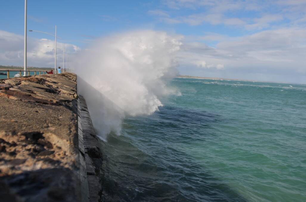 Wild weather causes spectacular waves to lash the Warrnambool breakwater. Picture: Morgan Hancock