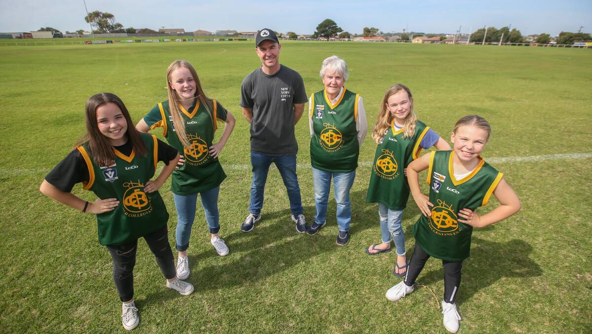 STRONG RETURN: Old Collegians coach Rod 'Rudy' Ryan, pictured with his mother Fran Ryan and the next generation of Warriors coming through, is pleased with how the team is travelling.