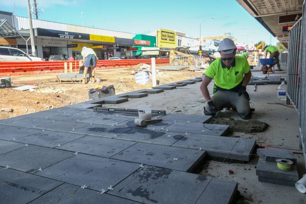 NOW COMPLETE: Bluestone pavers by Port Fairy's Bamstone being laid along Liebig Street by Jorge Gardner from Kings Landscaping as part of the Warrnambool CBD renewal stage one works last year.  Picture: Amy Paton