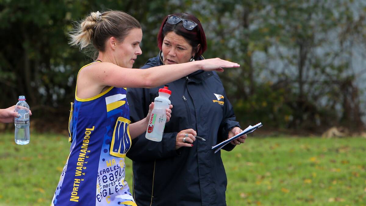 PLAN OF ATTACK: North Warrnambool Eagles co-coaches Elisha Carter and Jody Roth compare notes during a game. Picture: Rob Gunstone