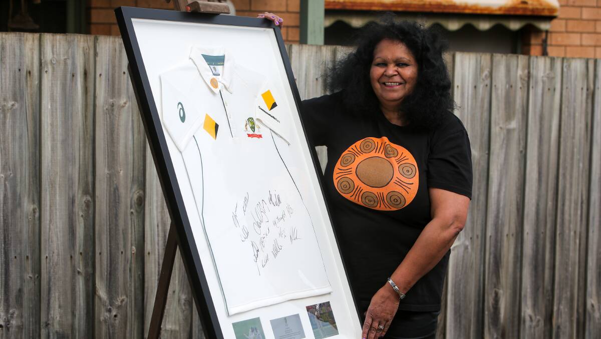 Talent: Warrnambool artist Fiona Clarke has been presented with an Australian Cricket top, signed by the players from the Boxing Day Test, in recognition of the indigenous design she created. Picture: Rob Gunstone