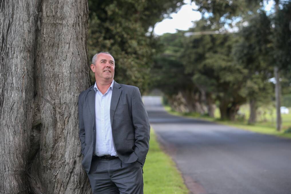 Moyne Shire director of physical services Trev Greenberger with the aging cypress trees on James Street, which have been recommended for removal. Picture: Amy Paton