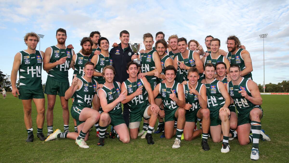NEW ERA: Hampen league players celebrate their win over South East FNL at Casey Field. It was Jonathan Brown's first year as coach. Picture: Rob Gunstone