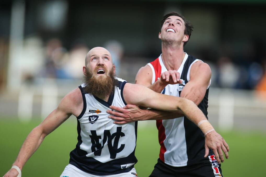 EYES ON THE BALL: Warrnambool ruckman Dan Weymouth and Koroit ruckman Jeremy Hausler keep each other in check at a throw in. Picture: Amy Paton