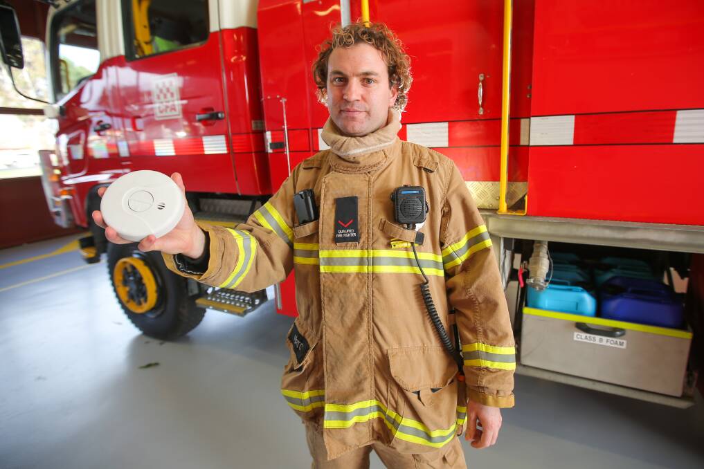 Be prepared: Firefighter Leon Morton is stressing the importance of fire safety heading into winter. Having a working, up-to-date fire alarm is crucial. Picture: Morgan Hancock