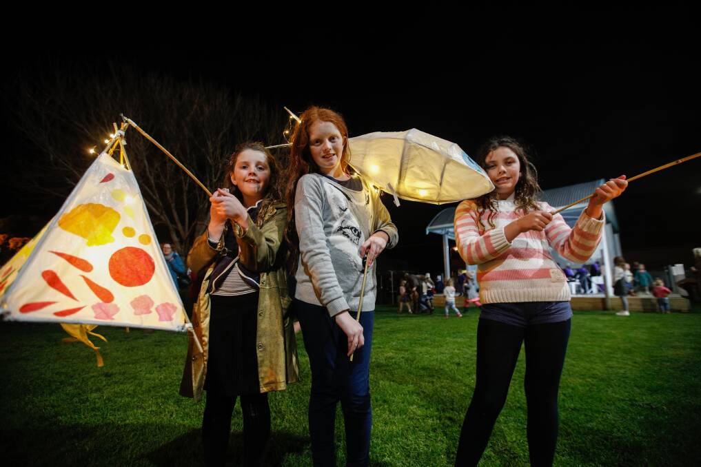 IMPRESSIVE: Sisters Charlotte, 8, Isabella, 11, and Sarah Condon, 9, model the lanterns they made  for the Winter Weekend parade in Port Fairy last year. Picture: Amy Paton