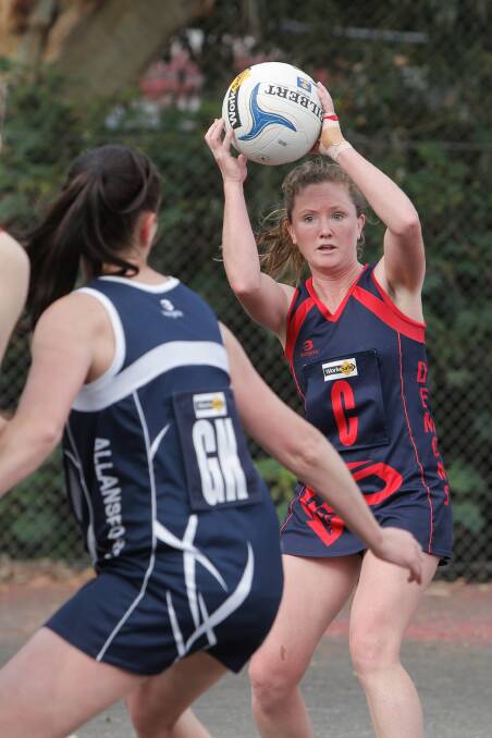 LOOKING FOR OPTIONS: Timboon Demons centre Kelly Gowland tries to get the ball safely into attack against Allansford on Saturday. Pictures: Amy Paton