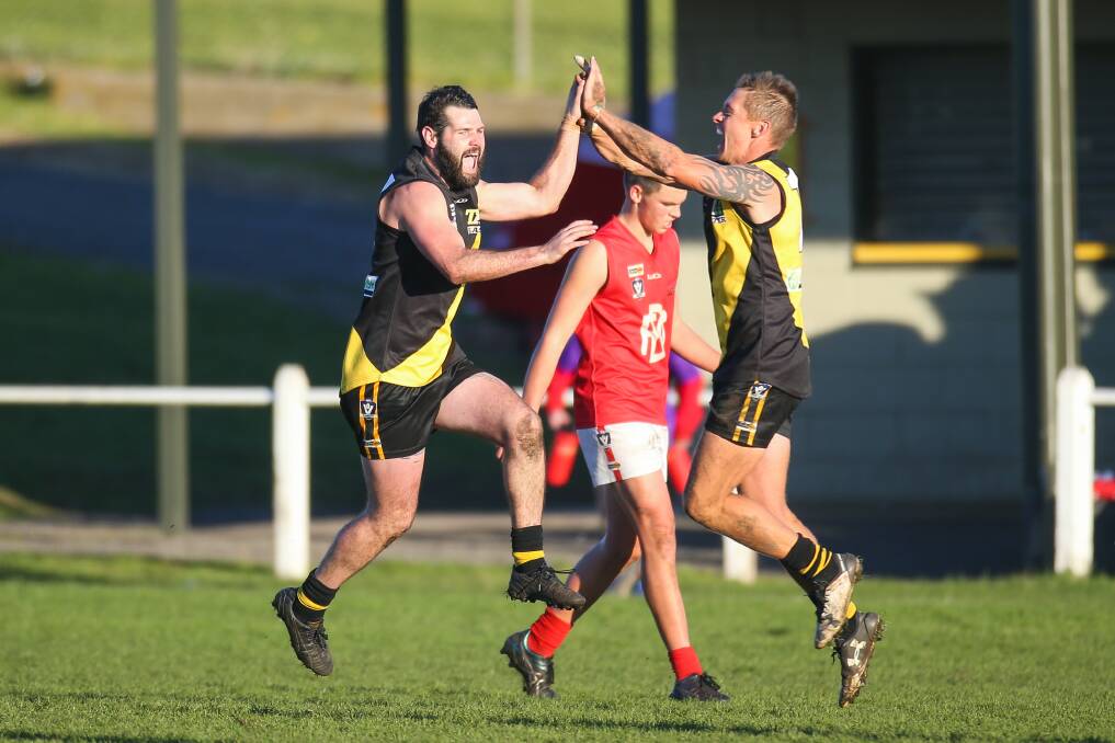 Happy days: Merrivale's Letham Robe and Jason Rowan celebrating a goal during the 2017 Warrnambool and District league season. Robe will return to the club next year. Picture: Morgan Hancock