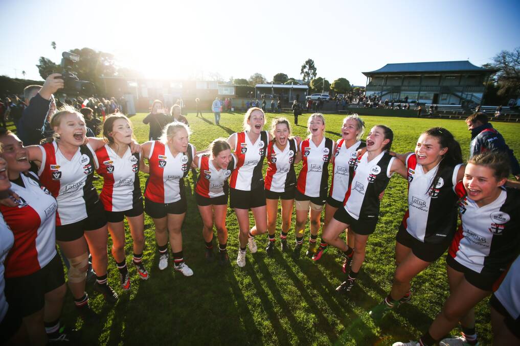 SING IT LOUD, SING IT PROUD: Horsham Saints players belt out the club song after their win in Sunday's inaugural female football league grand final. Pictures: Morgan Hancock