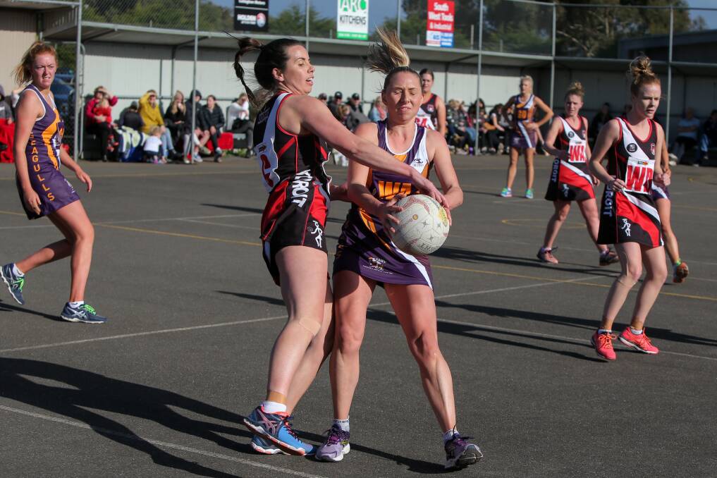 UNDER PRESSURE: Koroit centre Emily-Rose Finnigan and Port Fairy wing attack Ally Feely fight for the ball in Saturday's match.