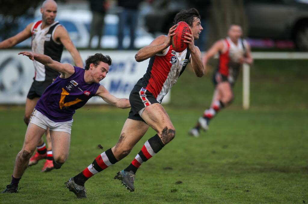 RACING BACK: Koroit ruckman Jeremy Hausler,
pictured evading Cameron Pevitt earlier this season,
is a certainty to return on Saturday. Picture: Rob Gunstone