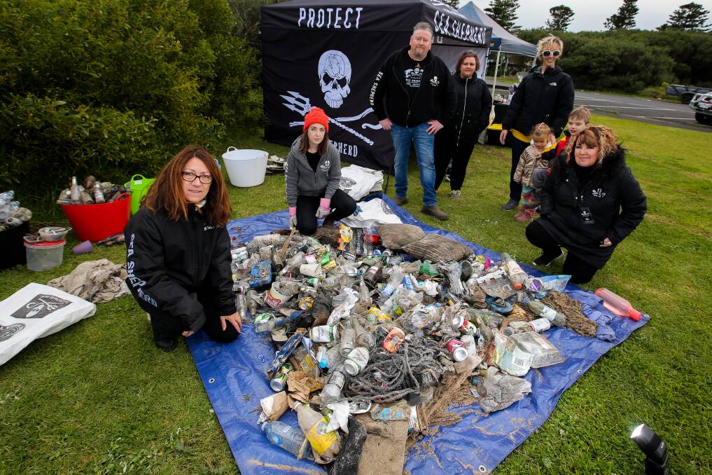 Clean up crew: Linda Metcalfe (left) with the Sea Shepherd on shore volunteers, and the rubbish collected from the Warrnambool foreshore. Picture: Rob Gunstone