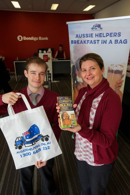 STANDARD, NEWS, BREAKFAST IN A BAG 170719 Pictured - Bendigo Banks customer relationship officer Dennis Holzer and customer service officer Monica Phillips are ready to collect goods for the Aussie Helpers Breakfast in a Bag program. Picture: Rob Gunstone