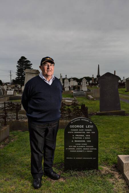 Jeffrey Everitt next to the gravestone of George Levi, one of Warrnambool's original settlers. Picture: Christine Ansorge