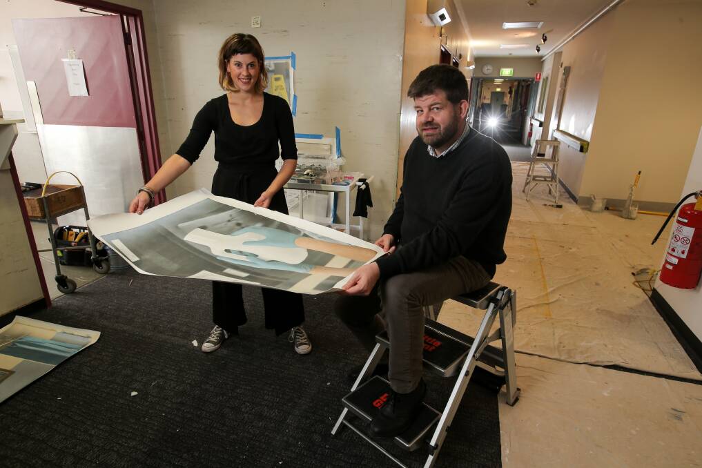 ART SURGERY: Melbourne artist Georgie Mattingley shows some of her work to South West Healthcare emergency physician Dr Tim Baker. Picture: Rob Gunstone