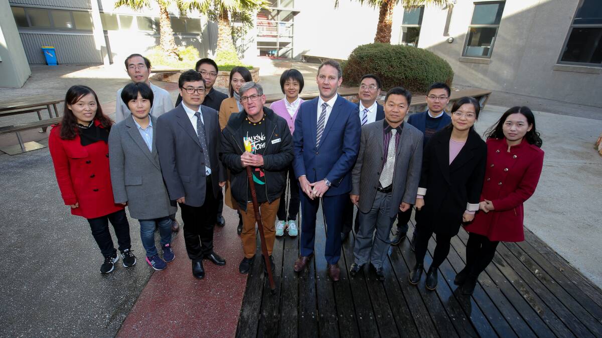 LEARNING: Indigenous elder Uncle Locky Eccles South West TAFE CEO Mark Fidge  with the group of teachers from Yangzhou Polytechnic Institute in China. Picture: Rob Gunstone