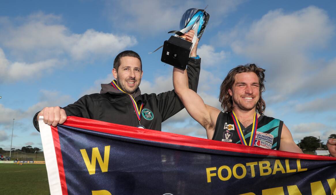 2017: Kolora-Noorat coach Danny Finn and captain Joey Conheady with the premiership cup and flag. Picture: Rob Gunstone 