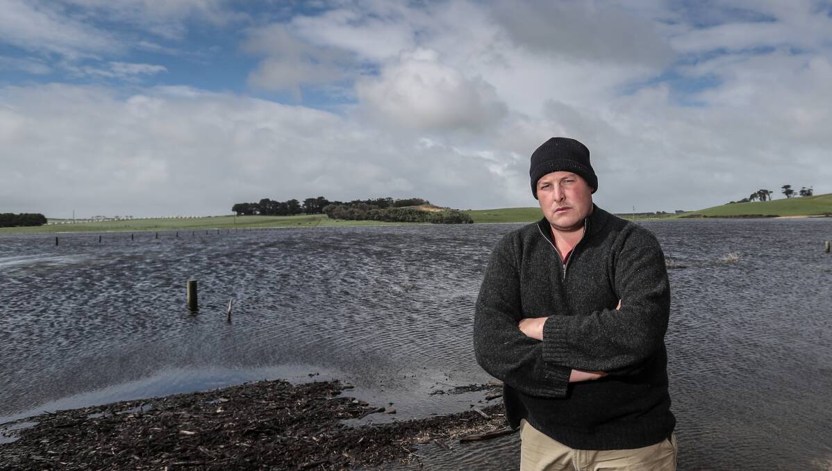 Still blocked: Ben Holloway is among the Allansford farmers whose paddocks have been flooded because of the blocked Lake Gillear drain. Picture: Christine Ansorge