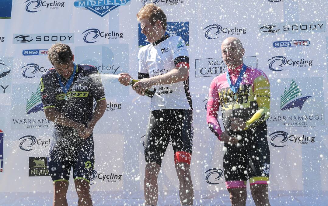 CELEBRATION: 2017 Melbourne to Warrnambool placegetters (l-r) Sam Welsford, Nathan Elliott and Tommy Nankervis shower each other with champagne on the dais. Picture: Rob Gunstone