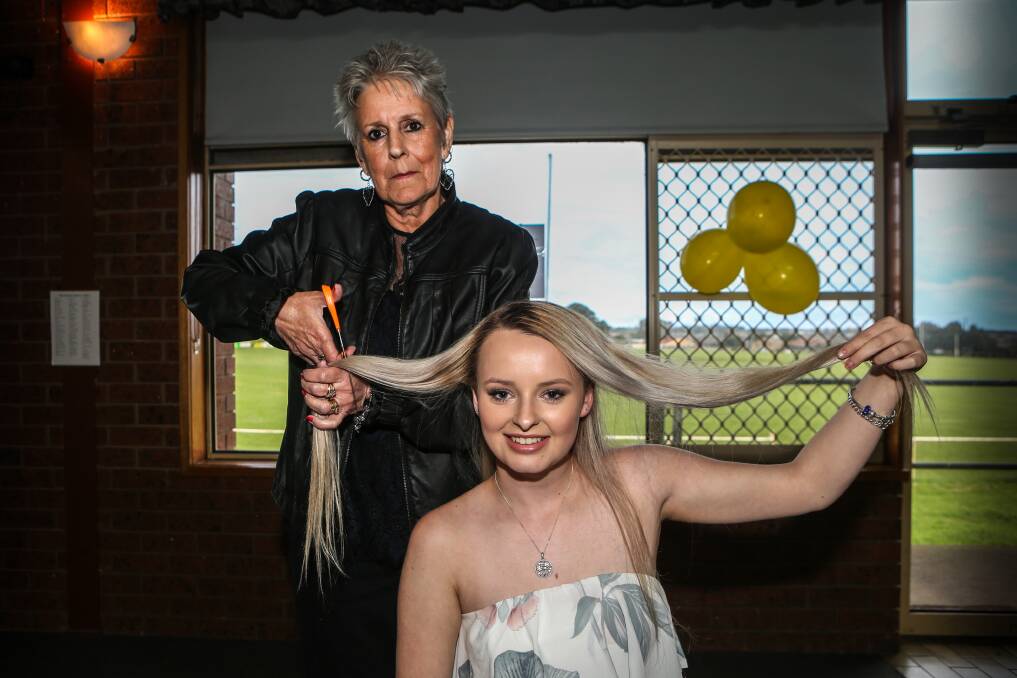 GOING, GOING: Georgia Billings, 16, is shaving her hair for the cancer council. Her grandmother Sharon Billings, who has suffered from breast and stomach cancer, will be the first person to cut off some of Gerogia's hair. Picture: Christine Ansorge
