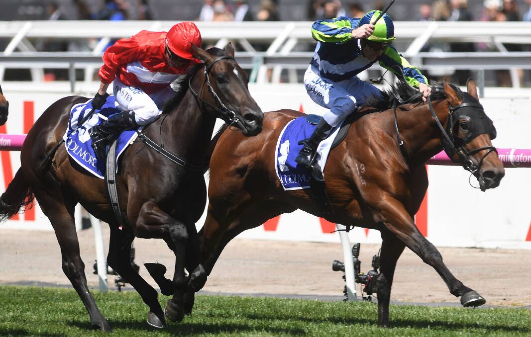 GOOD STOCK: Mark Zahra rides Merchant Navy (right) to victory in the Coolmore Stud Stakes on Derby Day at Flemington in 2017. Picture: AAP Image/Julian Smith
