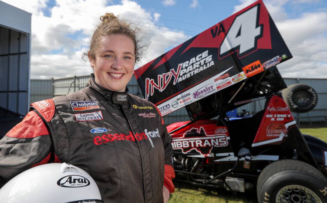 CLOSE CONNECTIONS: Carly Walsh, standing in front of her family-owned sprintcar, has many of her relatives nearby for every race day. Picture: Rob Gunstone