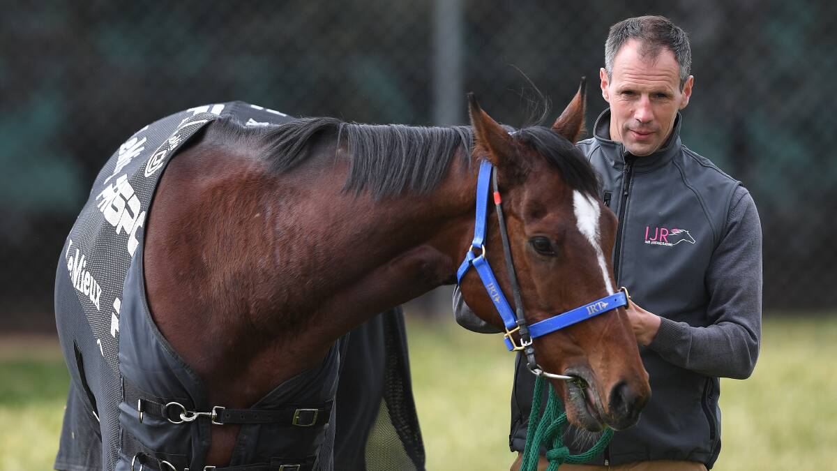 Trainer Iain Jardine is seen with Nakeeta at Werribee racecourse in Melbourne. Picture: AAP Image/Julian Smith