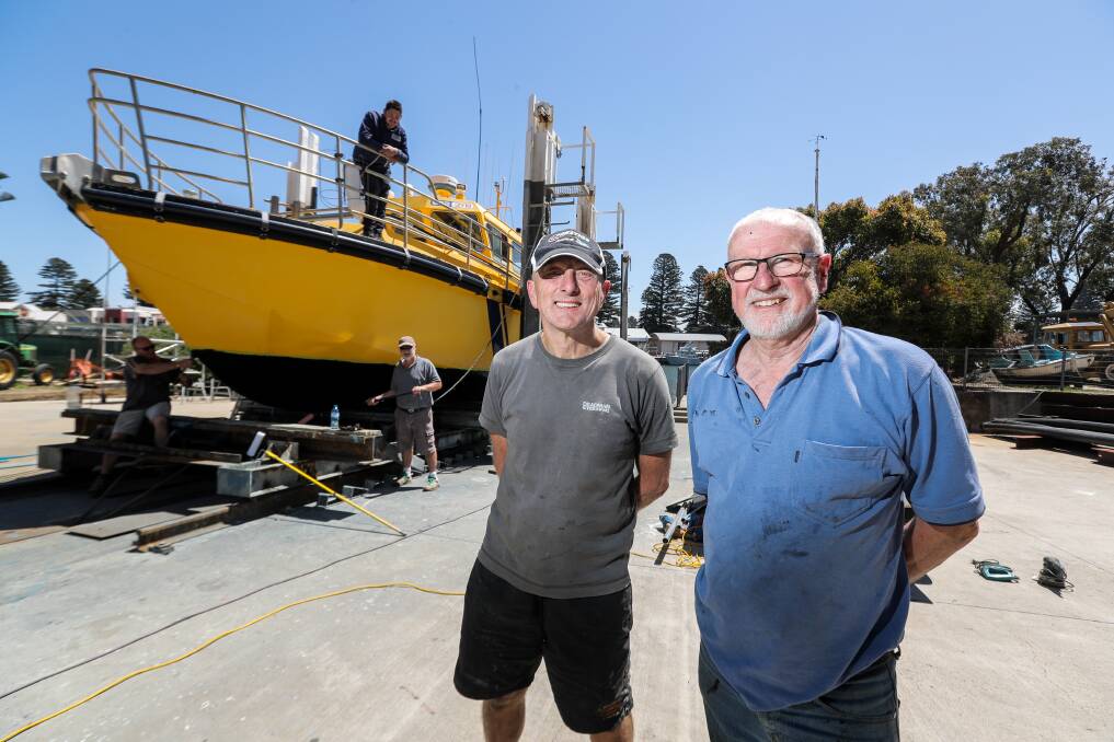 READY: Coast Guard Warrnambool skipper Keith Prest and commander Allan Wood are getting the boat ready for summer. Picture: Rob Gunstone