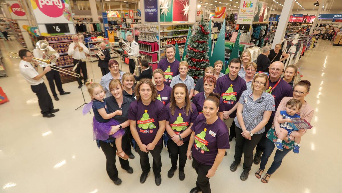 Time to give: Kmart staff are ready to help those people who would like to place a gift under the Wishing Tree. Picture: Rob Gunstone