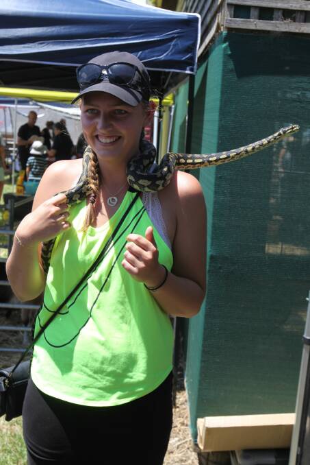 Just a cuddle: Nadia Werth of Denmark gets up close with a jungle carpet python at the Noorat Show.