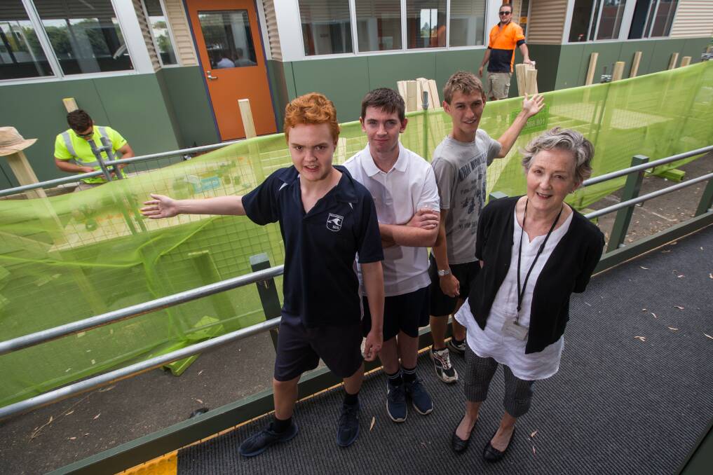 Extra space: Patrick Wilks, 15, Harry Creece, Brad Warnecke, 17 and Sue Fraser pictured in front of the new Warrnambool Special Developmental School building. Picture: Morgan Hancock