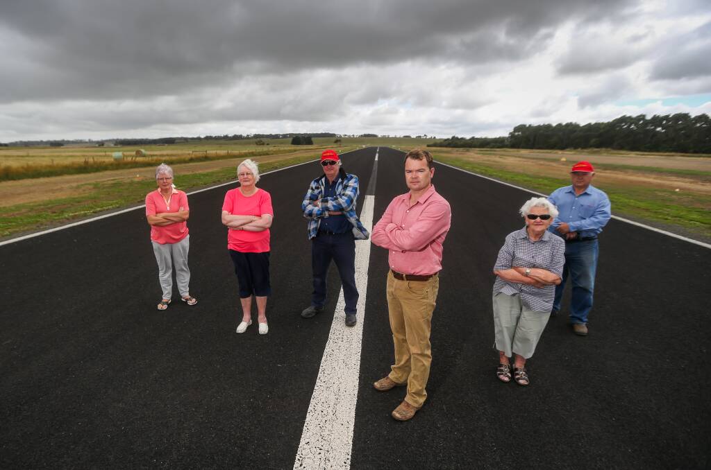 Cobden airport supporters Jan O'Connell, Eunie Dawe, Paul Moloney, Warren Ponting, Helen Watts and Stan Williams on the runway. Picture: Morgan Hancock