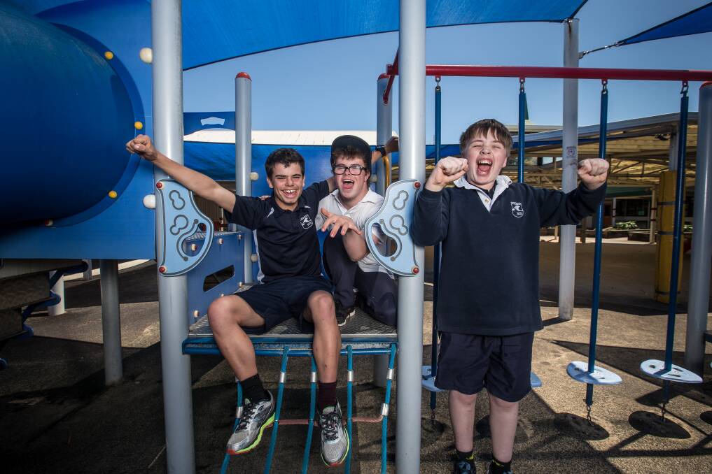 Cheers: Warrnambool Special Developmental School students Joel Lehmann, 16, Caleb Cocking, 16 and Declan Baulch, 13 are excited about government funding which will allow them to build a new school. Picture: Christine Ansorge