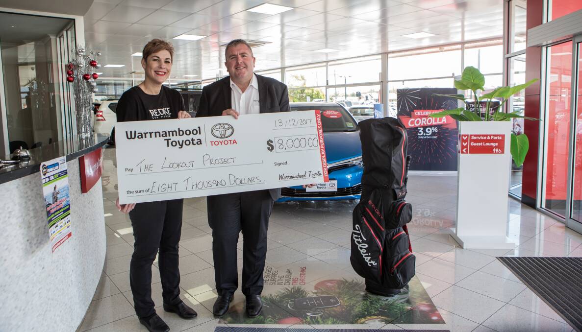 GREAT: Warrnambool City councillor Sue Cassidy and Warrnambool Toyota dealer principal Matthew Burgess hold the cheque for The Lookout. Picture: Christine Ansorge