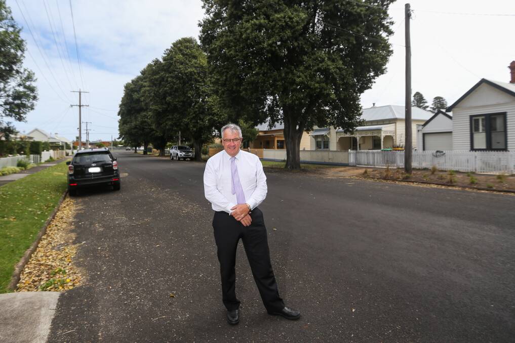 ICONIC: Moyne Shire councillor Colin Ryan was in favour of a council motion passed last night to retain the historic 'itchy bomb' trees on the street. Picture: Morgan Hancock