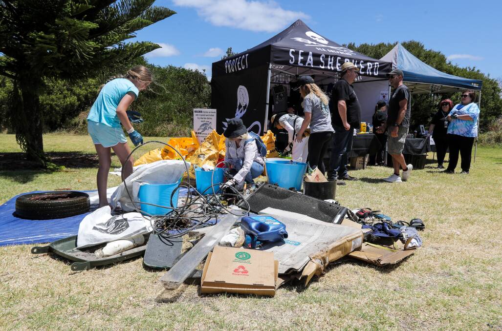 Photographer ROB GUNSTONE captures these pictures of the rubbish collected at Stingray Bay in Warrnambool on Sunday.