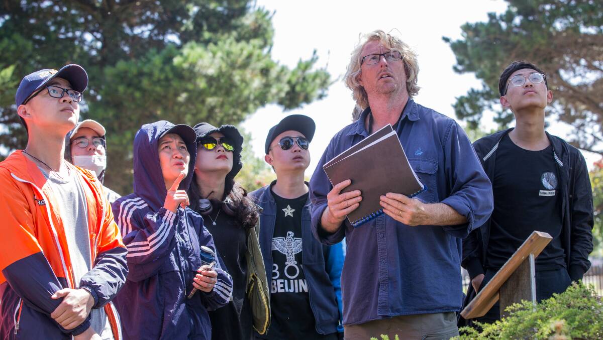 Insight: Curator John Sheely shows students around the gardens.