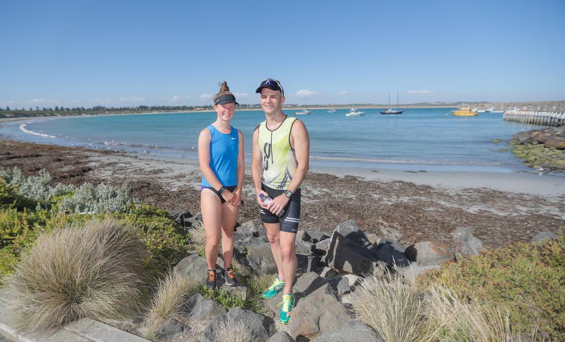 Victors: Female and male winners, Stephanie Hibburt and Andy Ryan, after the 2017 foreshore triathlon. Picture: Morgan Hancock