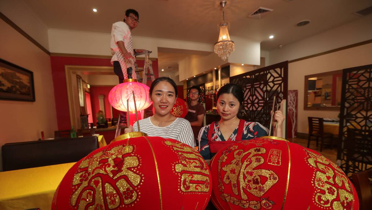 Ready to celebrate: Emperor's House staff Jiawei Zheng, Hai Yun Zheng, Xueping Shen, and owner Lin Chen are putting the final touches up before Chinese New Year celebrations. Picture: Rob Gunsotne