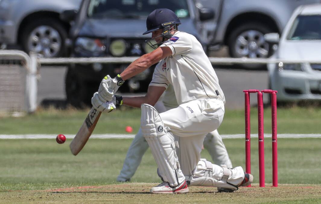 GETTING LOW: West Warrnambool batter Ben Threlfall down on one knee to punch the ball square. Picture: Rob Gunstone