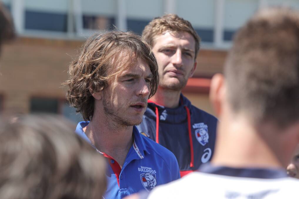 Hanging up the boots: Western Bulldogs player Liam Picken, here during a visit to Emmanuel College, has retired from the AFL following ongoing concussion symptoms. 
Picture: Rob Gunstone