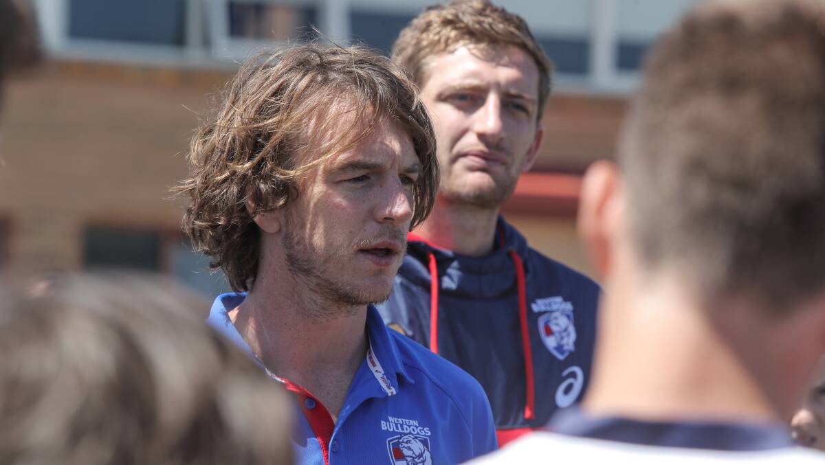 Retired: Western Bulldogs player Liam Picken gives directions to the Emmanuel College year 9 football players during a visit to the school. Picture: Rob Gunstone