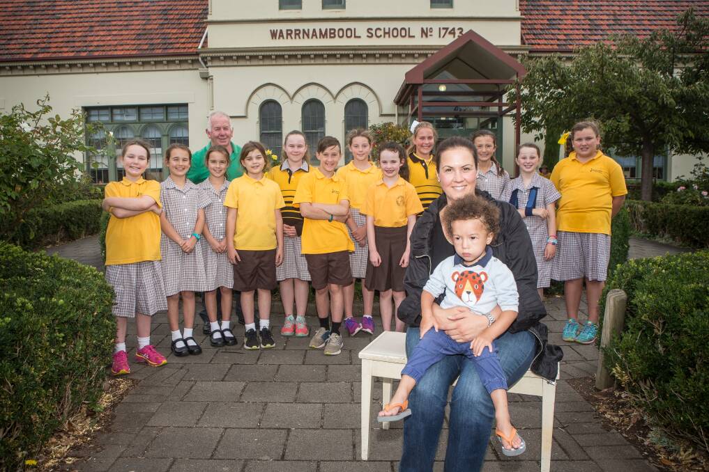 GIVING: Warrnambool Primary School's social music group raised much needed money for Julian Purcell, 2. His mother Courtney Purcell is hoping to raise enough funds to get her son an assistant dog. Picture: Christine Ansorge