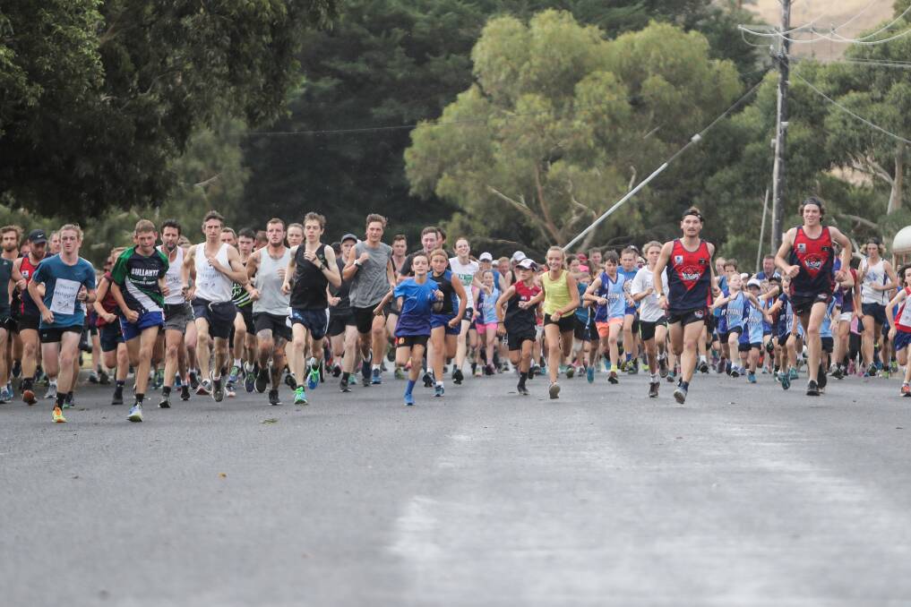 On your marks: Participants begin the 2018 Terang fun run. The annual event will take place this Friday night, with warmer weather conditions expected then runners experienced last year. Picture: Morgan Hancock