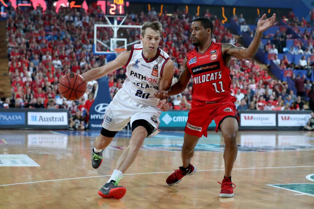 BIG NAMES: Adelaide 36ers' Nathan Sobey drives past NBL MVP and Perth Wildcats opponent Bryce Cotton in game two of their semi-final series on Friday night. Picture: AAP