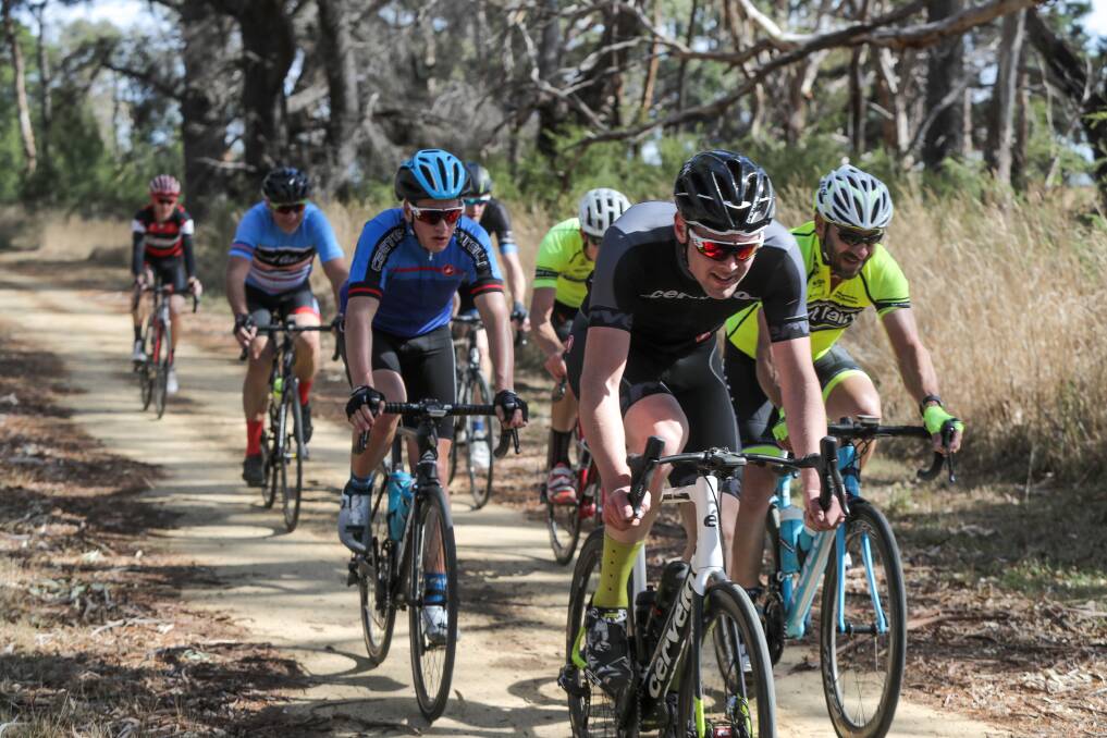 Rough terrain: Riders work hard along the gravel of the Port Fairy-Warrnambool rail trail as they complete laps along the dirt in last year's Hell of the South race. Picture: Rob Gunstone