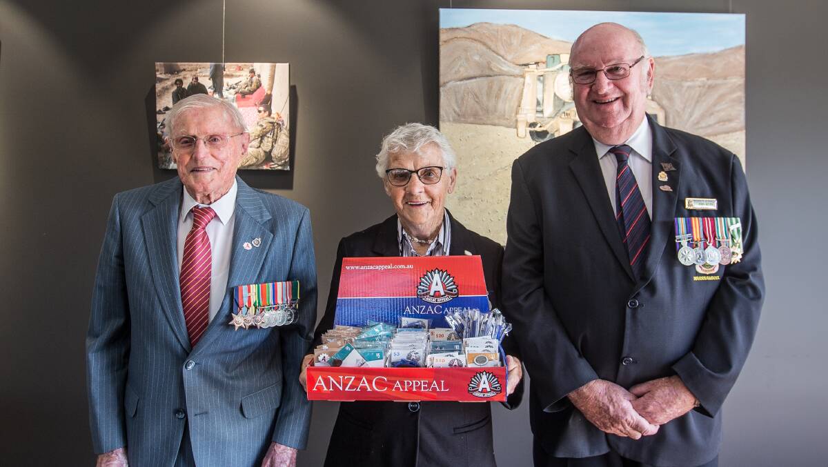 Appeal: Veterans Max Hammond and Margaret Morton with Warrnambool RSL president John Miles selling badges ahead of Anzac Day. Picture: Christine Ansorge