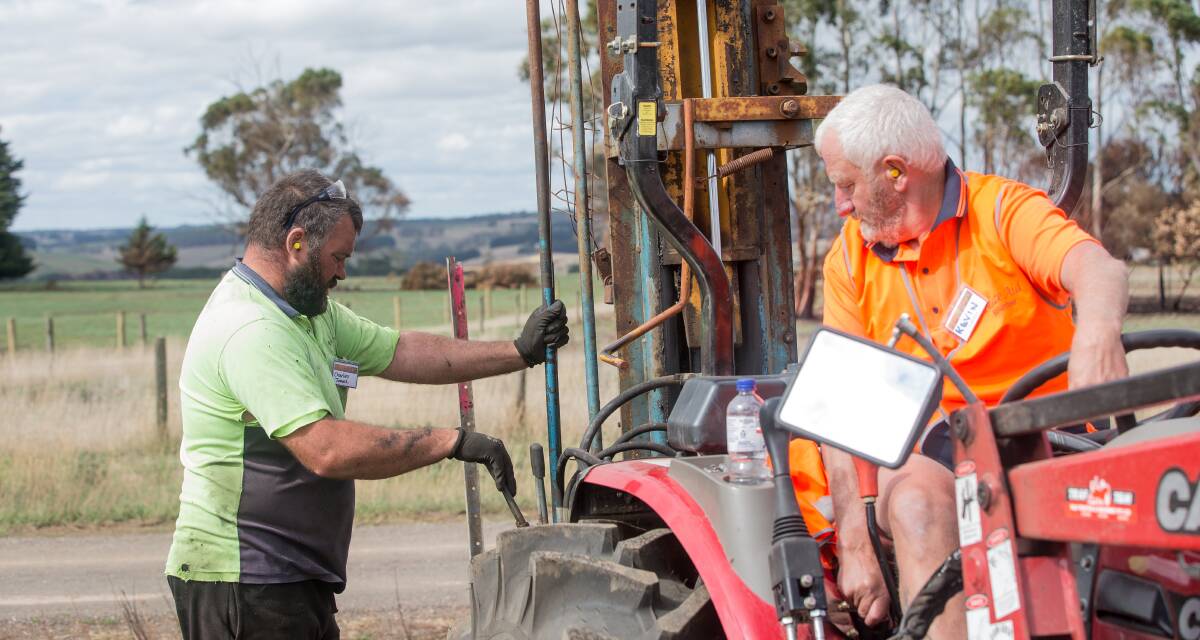 Ramming ahead: Blaze Aid volunteers Charles Jones and Kevin Harris set a fast pace ramming in posts to replace fences burnt on an Elingamite farm. Picture: Christine Ansorge