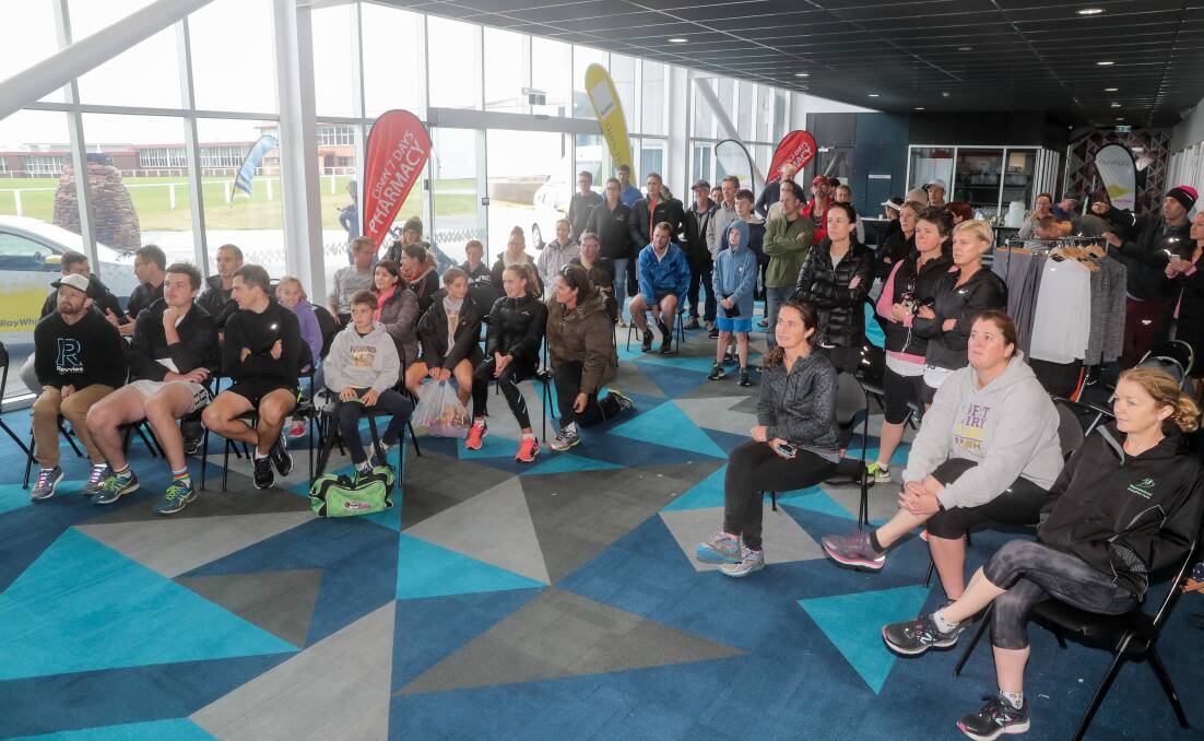 PROUD: Warrnambool Athletics club members gather at the Emmanuel Centre to cheer on Virginia Moloney in the Commonwealth Games marathon. Picture: Rob Gunstone